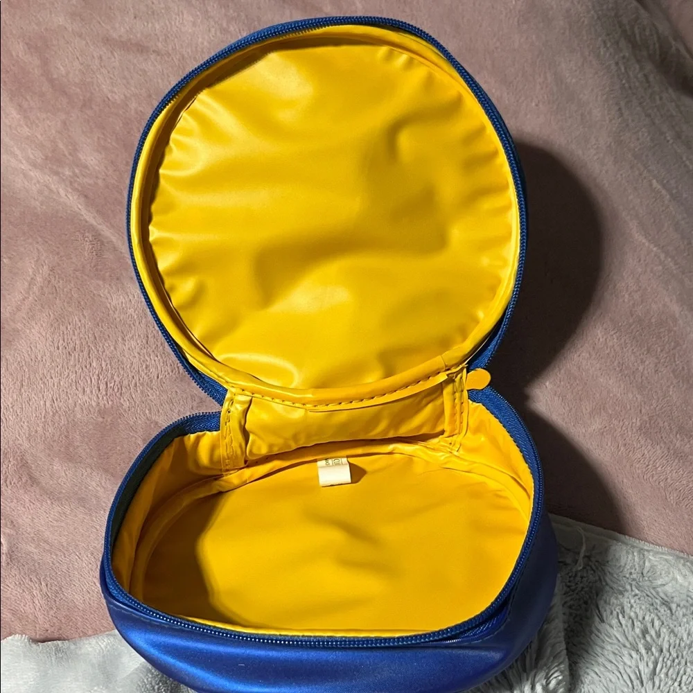 Clinique Blue floral cosmetics bag with Yellow Zipper